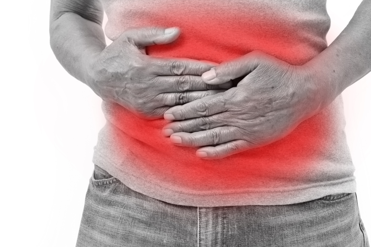 Gastrointestinal Digestive Issues 1 hand of old man holding stomach suffering from pain, diarrhea